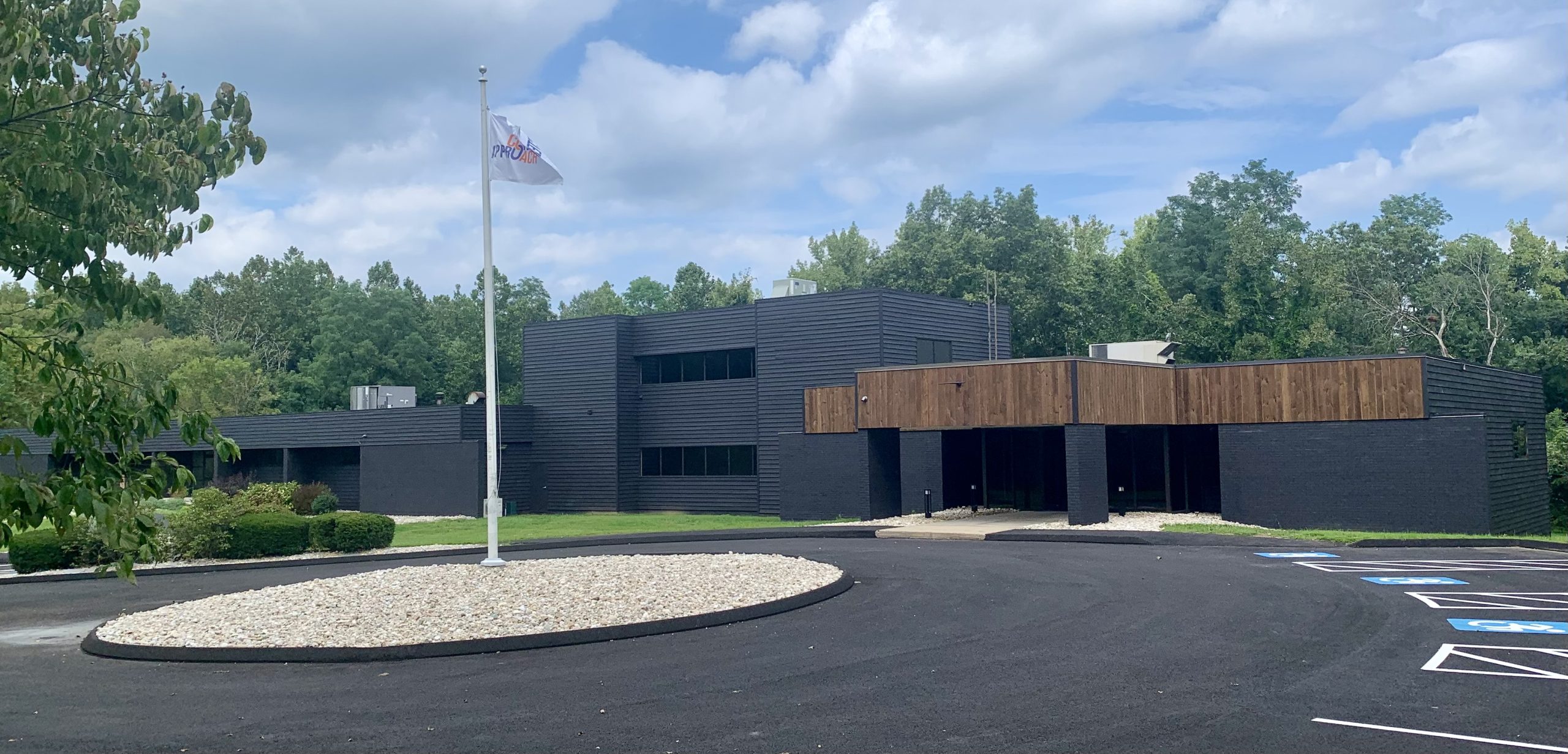 outside of leadership center with roundabout and flag